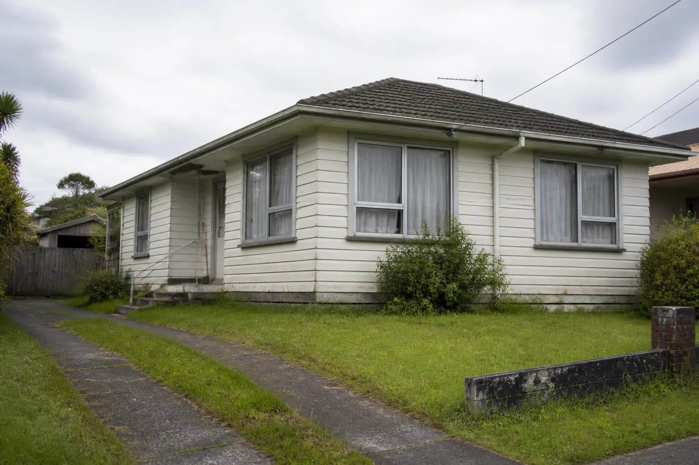 Older New Zealand suburban house with renovation upside — August 2026 sub-$750k investor stock